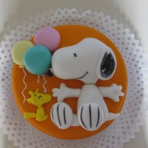 Snoopy y Woodstock con globos acostados